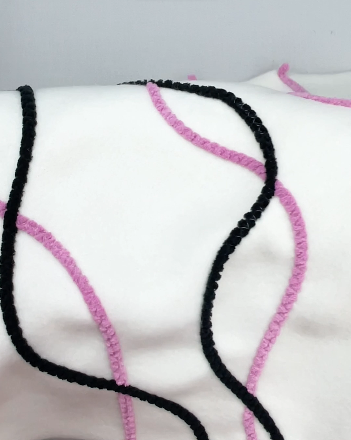 毛糸をぬいつける